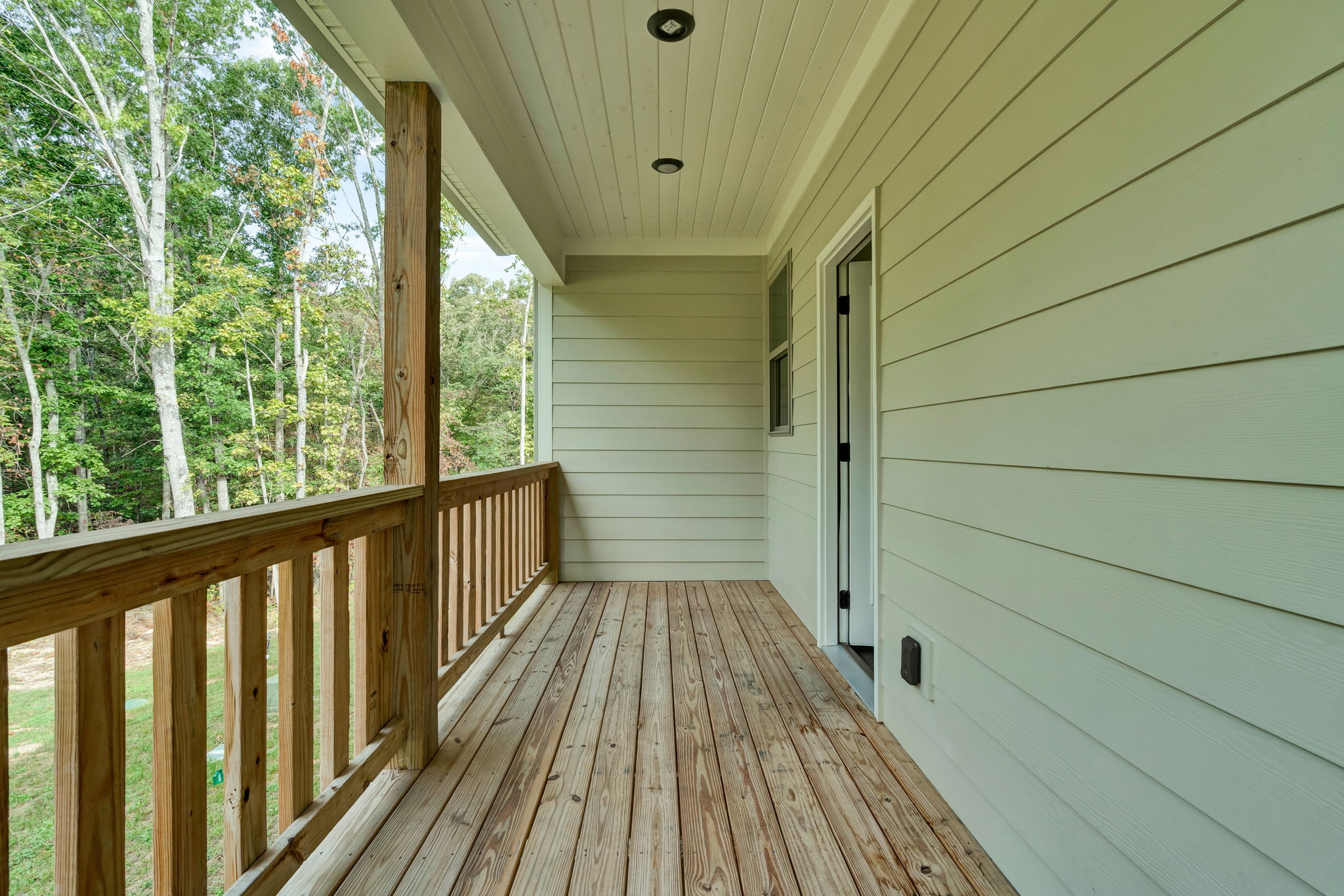 Private covered deck overlooking the trees